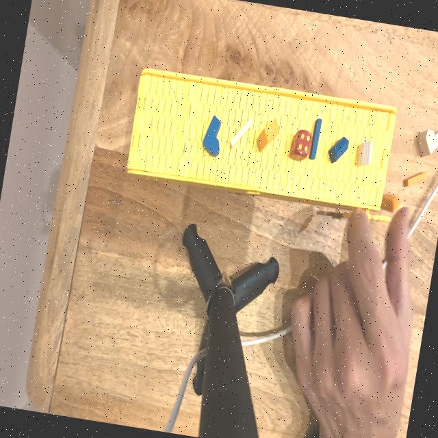 Example augmented training image showing noise and motion blur applied to conveyor belt scene